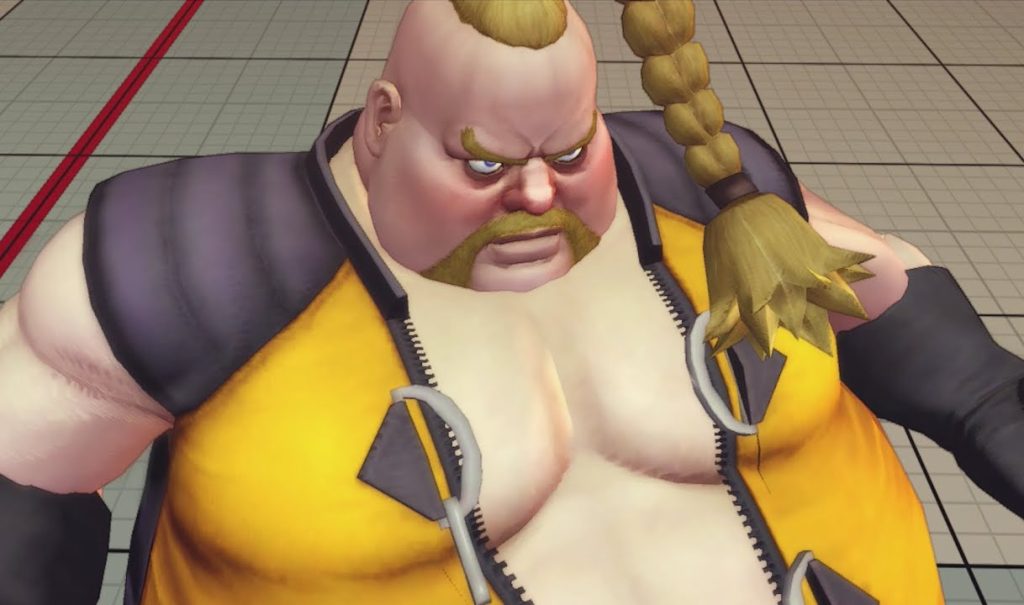 Rufus from Street Fighter, in a skin tight yellow outfit with black shoulders, and a blond plait.