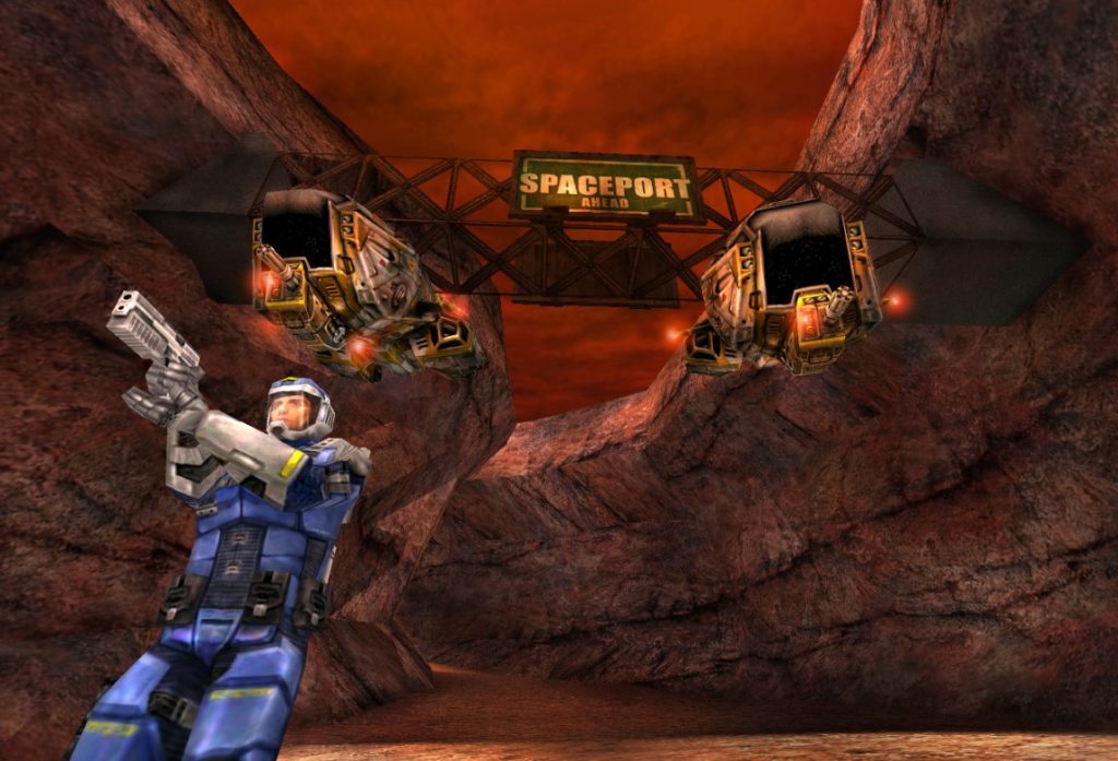 screenshot from Red Faction showing a player holding a gun on a rocky planet, with a sign above them saying 'spaceport ahead'