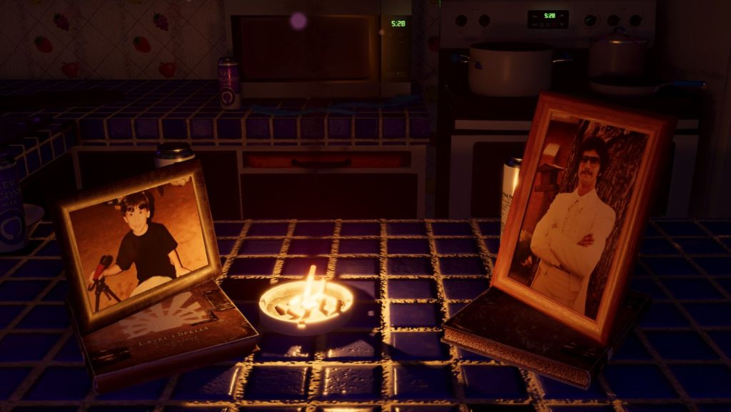 two photos in frames on a tiled kitchen counter, with an ashtray in the middle