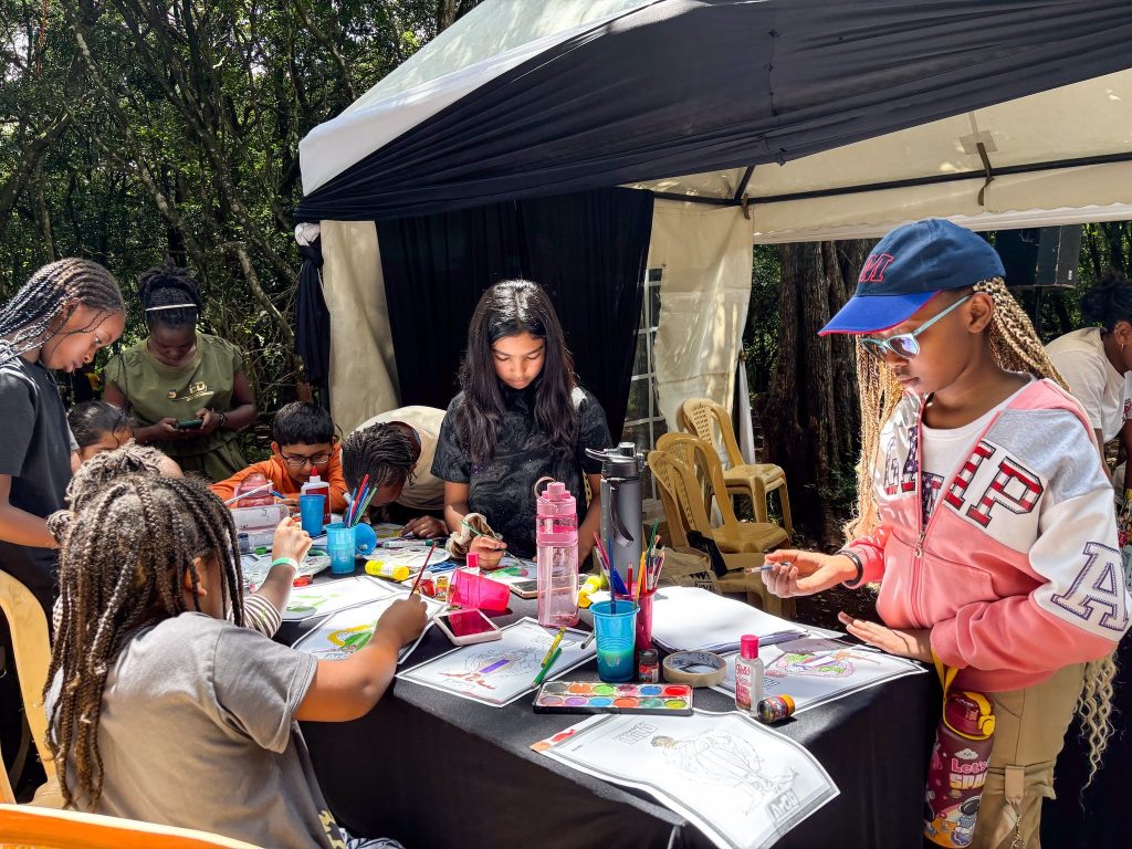 Children colouring in at a table.