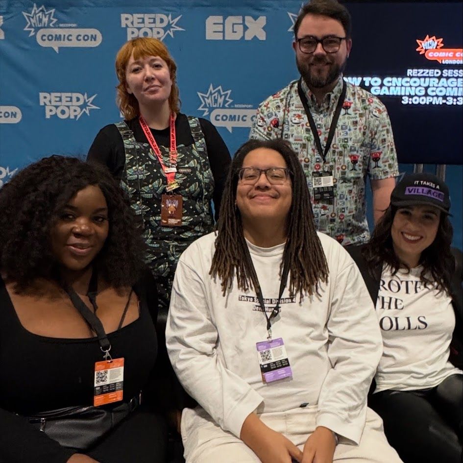 Sky Tunley-Stainton with a group of charity friends and Safe In Our World ambassadors representing mental health in games at MCM Comic Con in October 2025.
